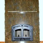 Full granite slab fireplace with matching granite shelf and hearth