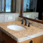 small granite bathroom counter with hand-chiseled edges