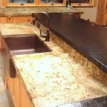 copper sink attached to a kitchen island