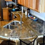 uniquely designed countertop with three chairs