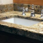 granite bathroom counter with hand chiseled edge