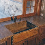 Custom granite sink and counters with hand carved rope detail