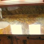 granite bathroom counter with single hole sink faucet