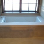 bath tub by the window