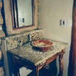 granite bathroom counter with backsplash and vessel sink